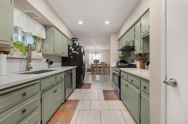 kitchen with green cabinets and stainless steel range with gas cooktop