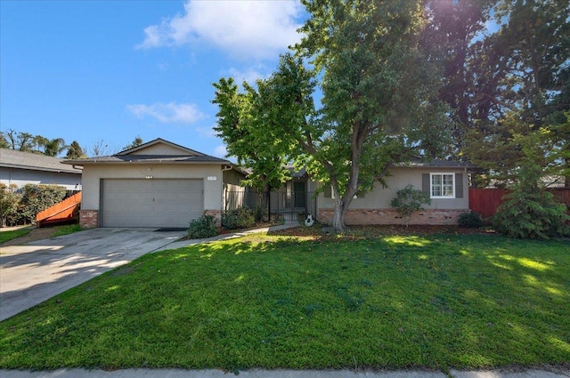 ranch-style house with concrete driveway, an attached garage, fence, a front yard, and brick siding