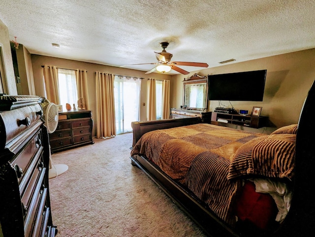 bedroom with light carpet, visible vents, ceiling fan, access to outside, and a textured ceiling