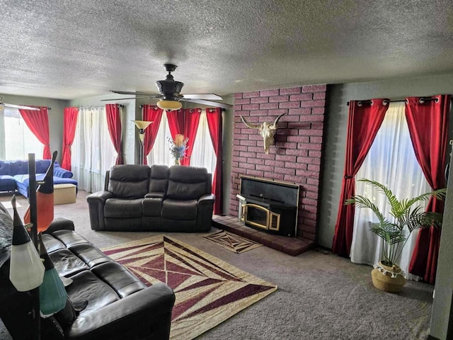 living area with carpet floors, a textured ceiling, and a ceiling fan