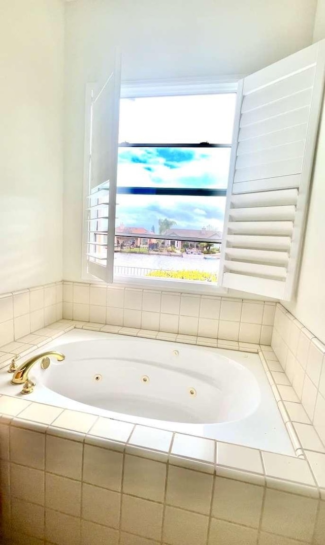 full bathroom featuring a jetted tub and radiator