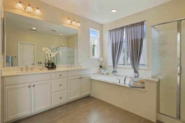 bathroom featuring double vanity, a shower stall, a bath, and a sink