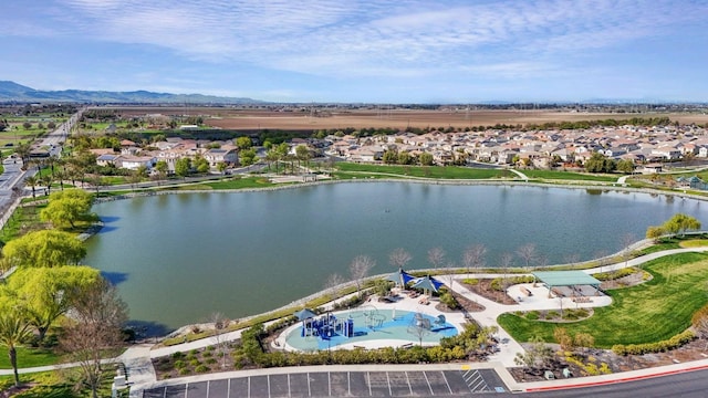 bird's eye view with a residential view and a water and mountain view