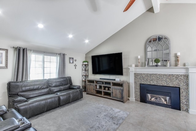 living room with tile patterned floors, high vaulted ceiling, recessed lighting, and a tile fireplace