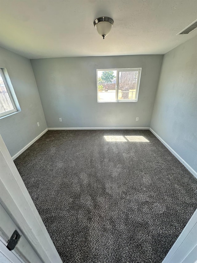 1301 Orange Ave, Chowchilla, CA 93610 - carpeted empty room featuring baseboards