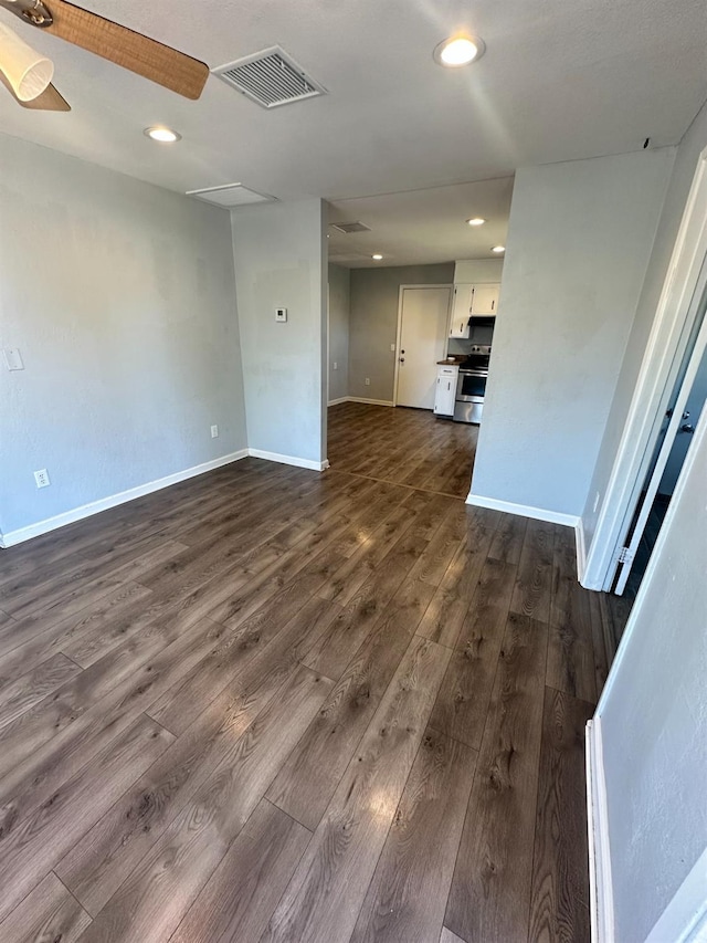 1301 Orange Ave, Chowchilla, CA 93610 - unfurnished living room with dark wood-style flooring, baseboards, recessed lighting, and a ceiling fan