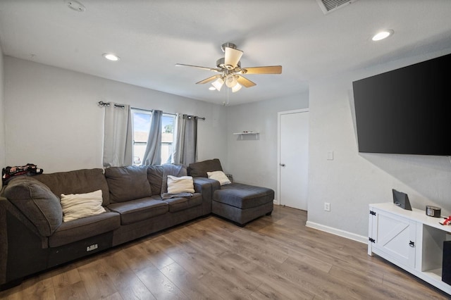 living area featuring visible vents, a ceiling fan, recessed lighting, light wood-style floors, and baseboards