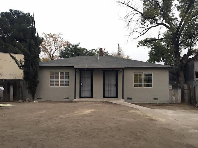 single story home with crawl space, fence, and stucco siding