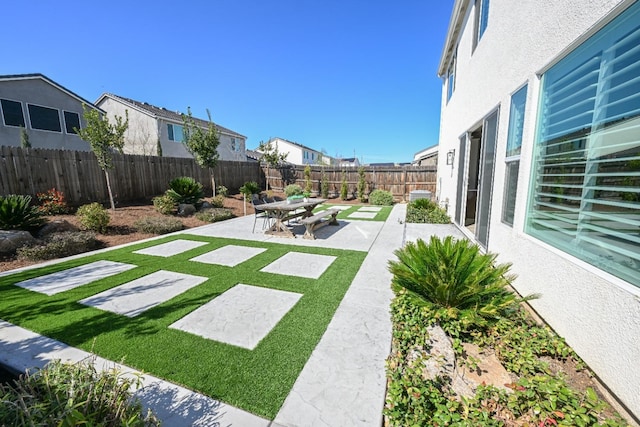 view of yard with a patio and a fenced backyard