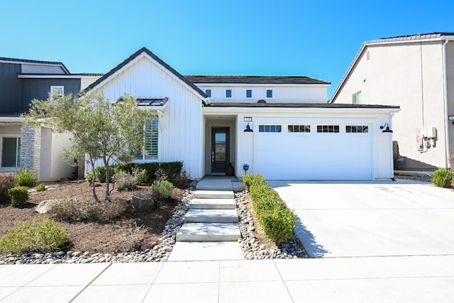 view of front facade featuring concrete driveway and a garage