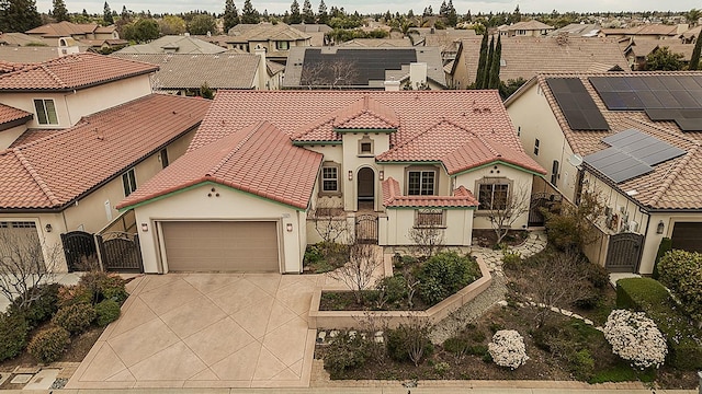 1562 N Empire Ln, Clovis, CA 93619 - view of front facade featuring a gate, a residential view, driveway, and a tiled roof