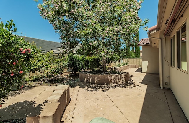 1562 N Empire Ln, Clovis, CA 93619 - fenced backyard featuring a patio area