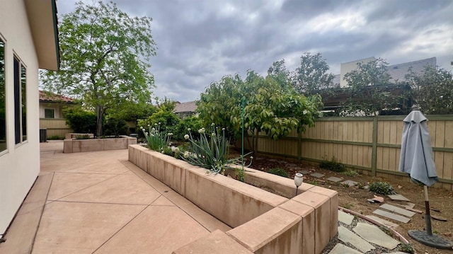 view of patio featuring fence