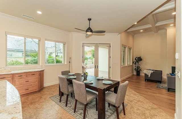 dining room with baseboards, french doors, visible vents, and ornamental molding