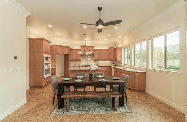 dining room featuring crown molding, recessed lighting, a ceiling fan, and baseboards