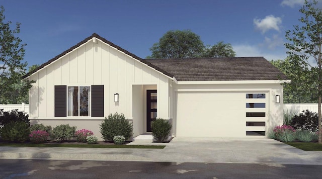 view of front of house with a garage, board and batten siding, and driveway