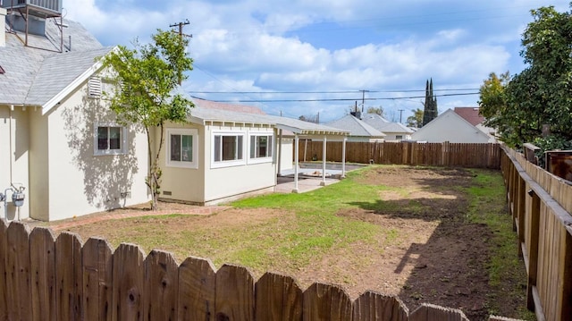 view of yard with a patio and a fenced backyard