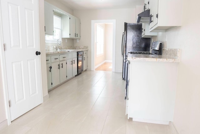 kitchen with range hood, baseboards, light tile patterned flooring, a sink, and dishwasher