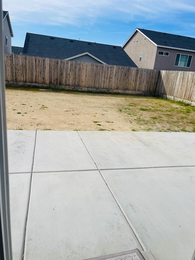 view of yard with a patio area and fence