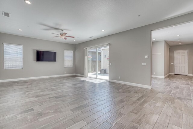 301 Pinnacle Dr W, Madera, CA 93636 - unfurnished living room with ceiling fan, light wood-style flooring, baseboards, and recessed lighting