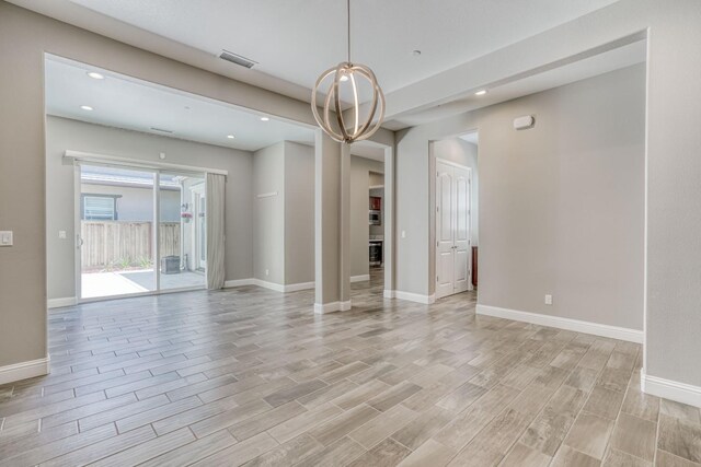 301 Pinnacle Dr W, Madera, CA 93636 - spare room with light wood-type flooring, recessed lighting, baseboards, and a chandelier