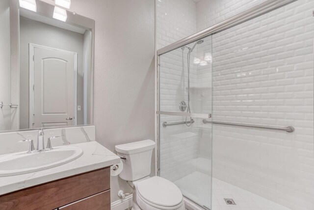 301 Pinnacle Dr W, Madera, CA 93636 - full bath with a stall shower, toilet, and vanity