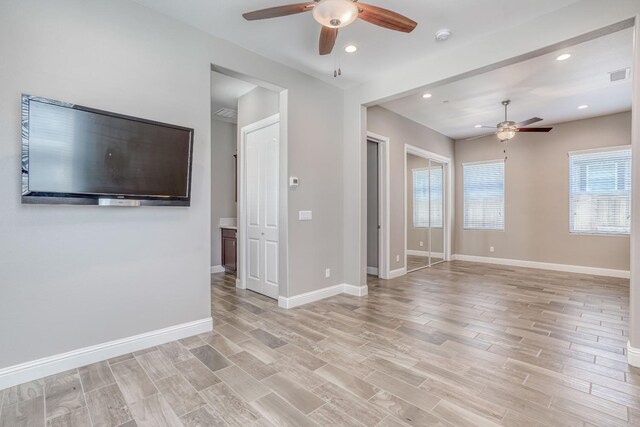 301 Pinnacle Dr W, Madera, CA 93636 - spare room featuring a ceiling fan, light wood-style flooring, baseboards, and recessed lighting