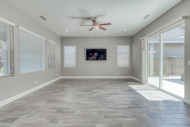 301 Pinnacle Dr W, Madera, CA 93636 - unfurnished living room featuring a ceiling fan, light wood-type flooring, baseboards, and recessed lighting