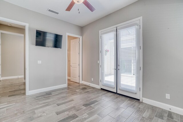 301 Pinnacle Dr W, Madera, CA 93636 - unfurnished room with ceiling fan, french doors, light wood finished floors, and baseboards