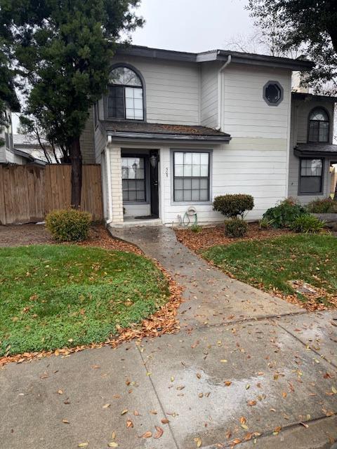 view of front of house with fence