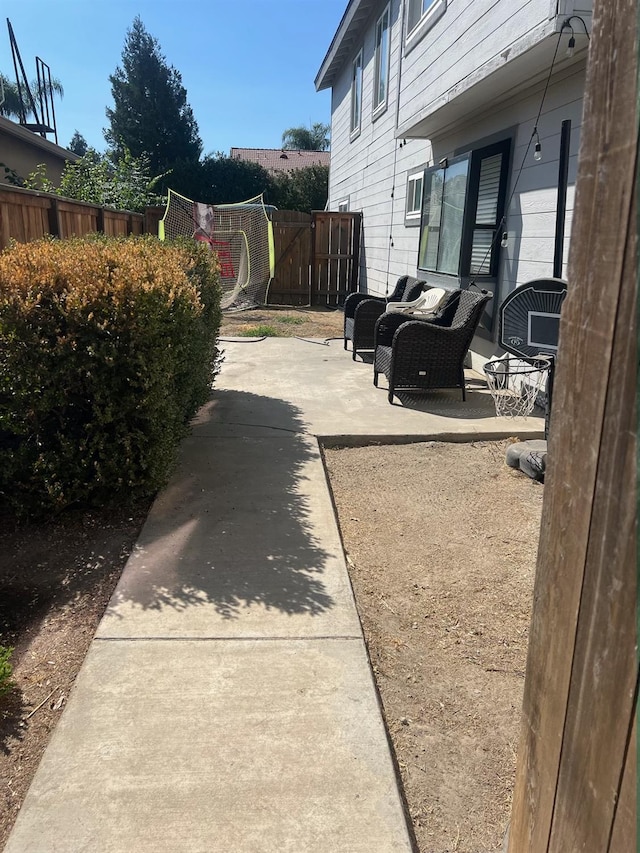 view of yard with a patio and fence