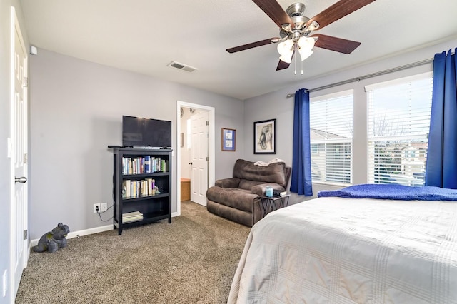 carpeted bedroom featuring visible vents, a ceiling fan, and baseboards