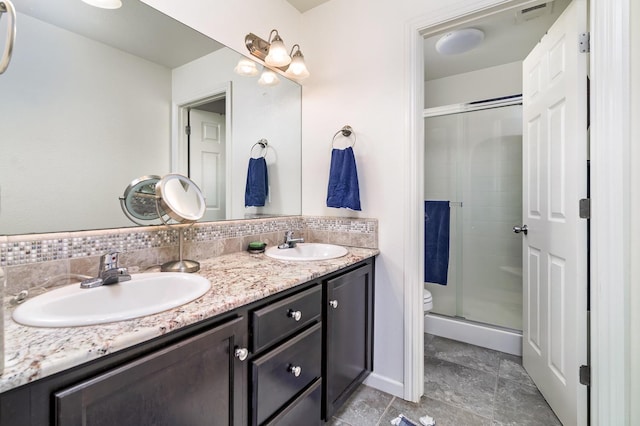 full bath featuring visible vents, a stall shower, and a sink