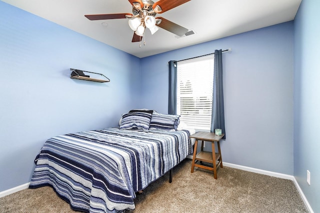 carpeted bedroom with baseboards and ceiling fan