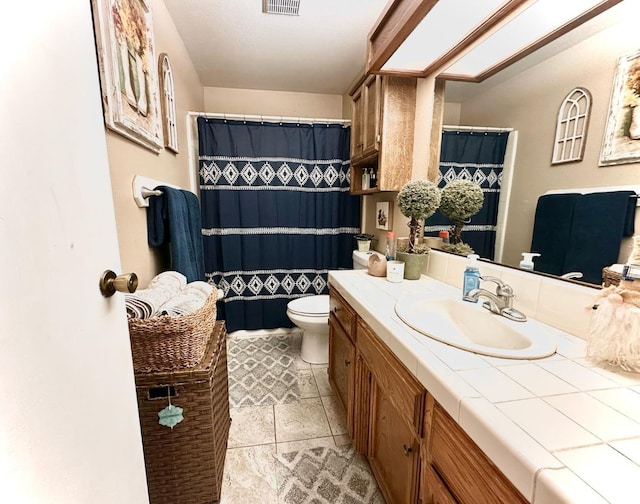 full bath with visible vents, toilet, and vanity