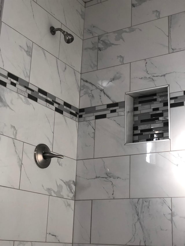 details with a tile shower