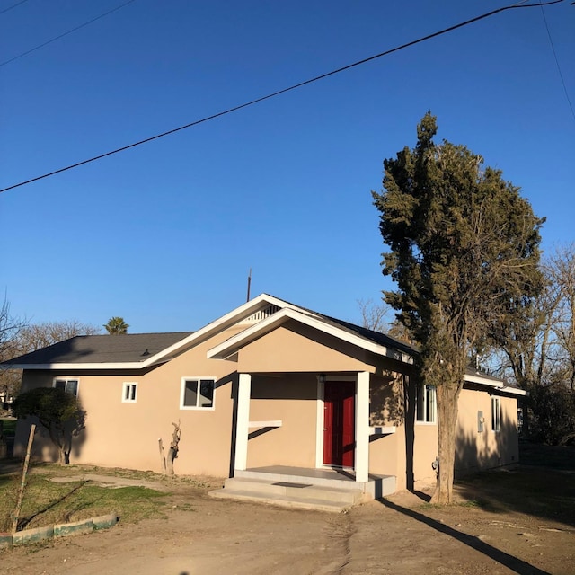 ranch-style house with stucco siding