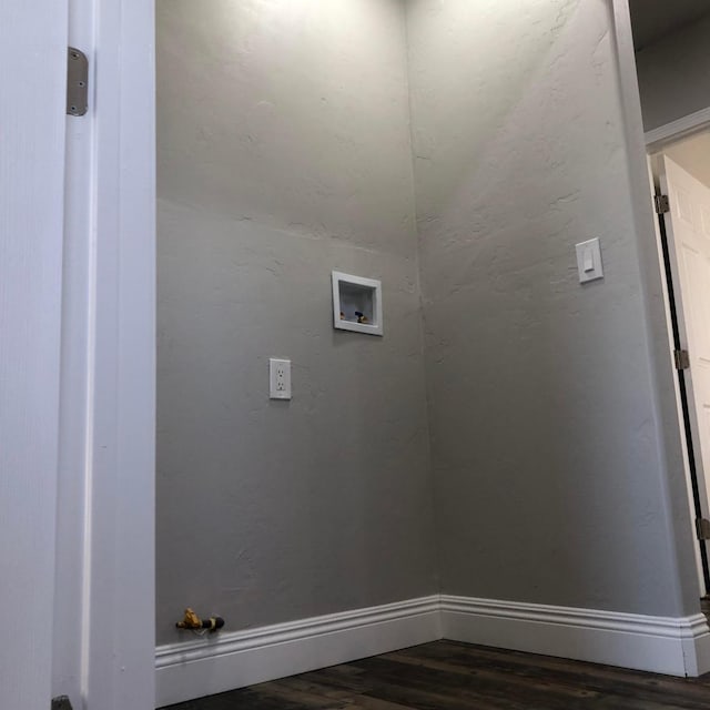 washroom featuring washer hookup, laundry area, wood finished floors, and baseboards