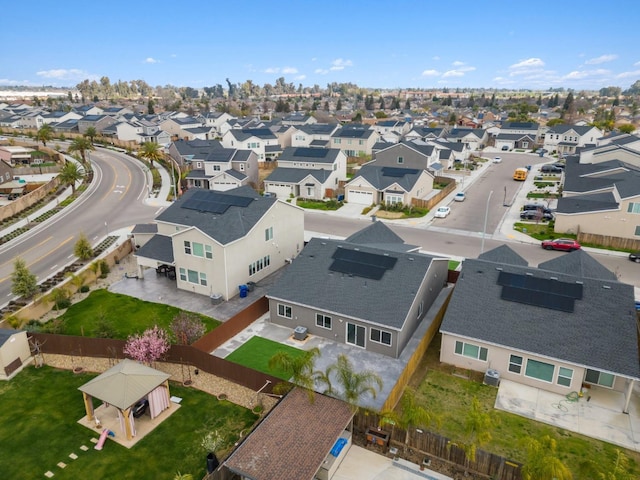 birds eye view of property with a residential view