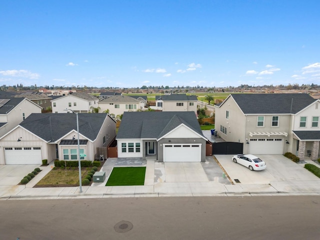 traditional-style home featuring a residential view and driveway