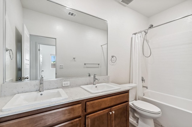 full bathroom with a sink, visible vents, shower / bath combo with shower curtain, and toilet