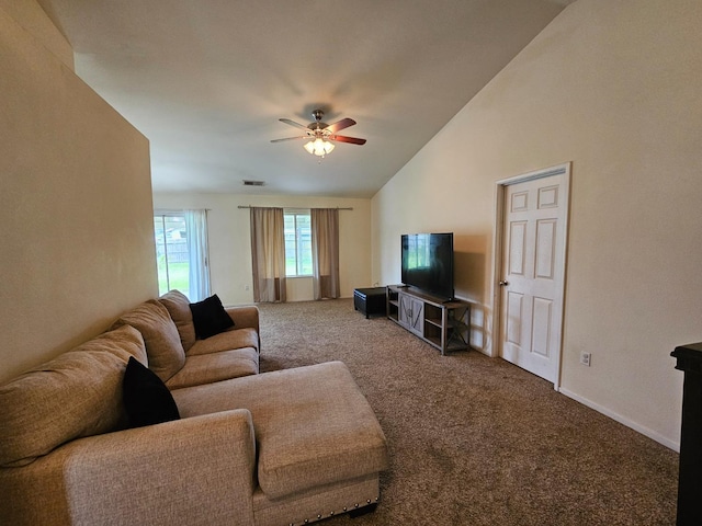 living area featuring visible vents, baseboards, carpet, lofted ceiling, and a ceiling fan