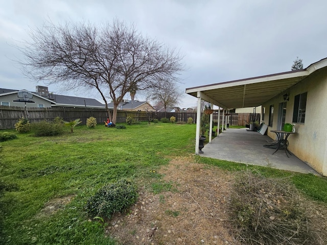 view of yard with a patio and a fenced backyard