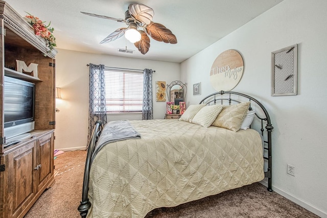 bedroom featuring ceiling fan, baseboards, visible vents, and light carpet