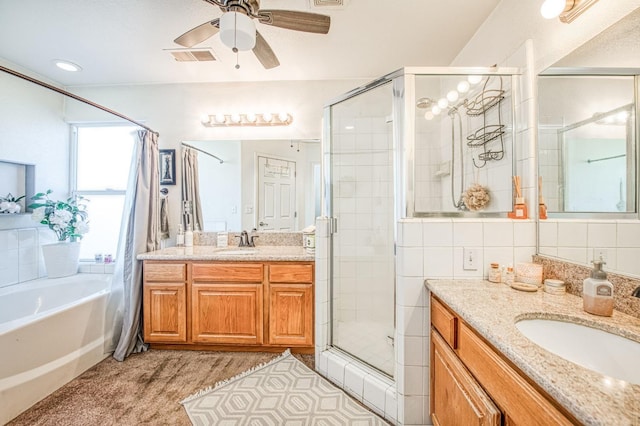 full bath featuring a sink, visible vents, two vanities, and a stall shower