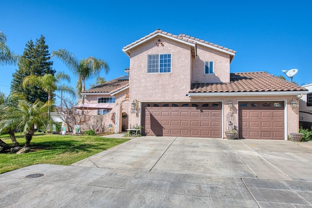 mediterranean / spanish-style home with stucco siding, driveway, roof mounted solar panels, a front yard, and a tiled roof