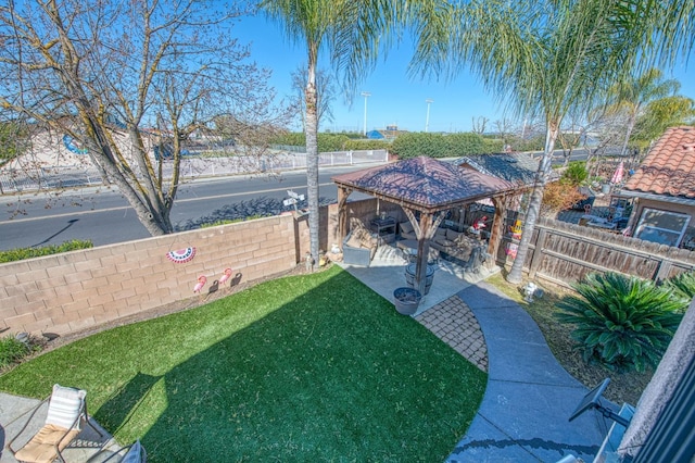 view of yard featuring a patio and a fenced backyard