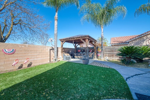 view of yard with a gazebo, a patio area, and a fenced backyard