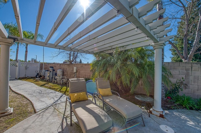 view of patio / terrace with a fenced backyard and a pergola