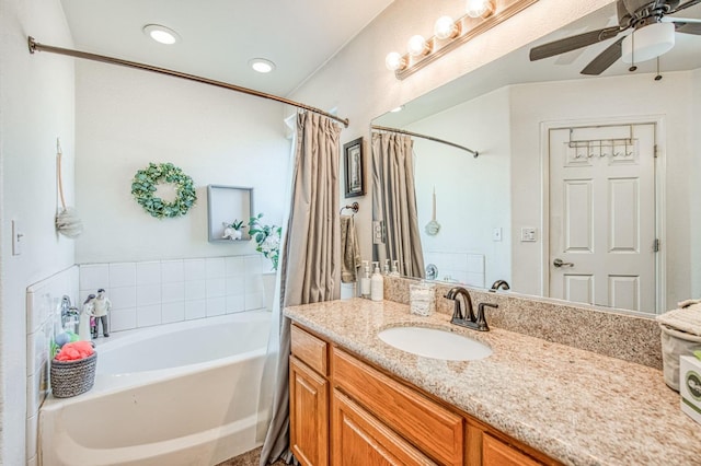 full bath with ceiling fan, recessed lighting, a shower with curtain, a bath, and vanity